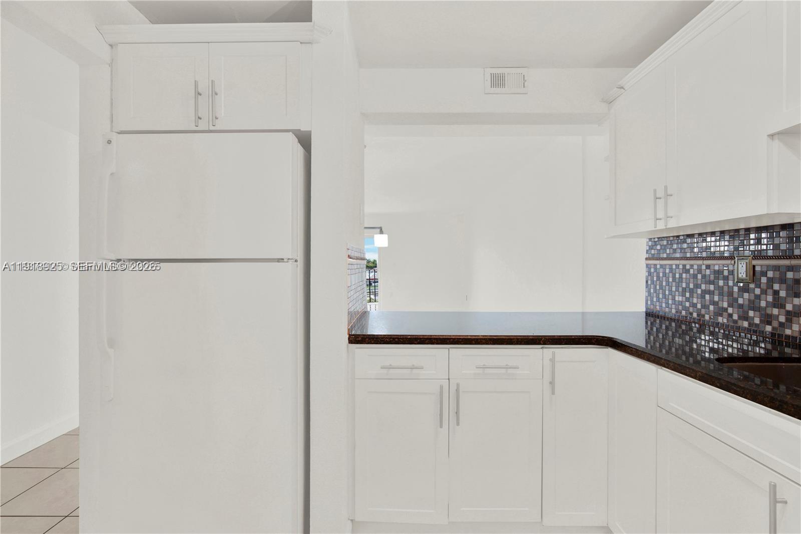 1990 West 56th Street, Unit 1407 Hialeah, FL 33012 - Photo 3 of 28 a view of a utility room with closet