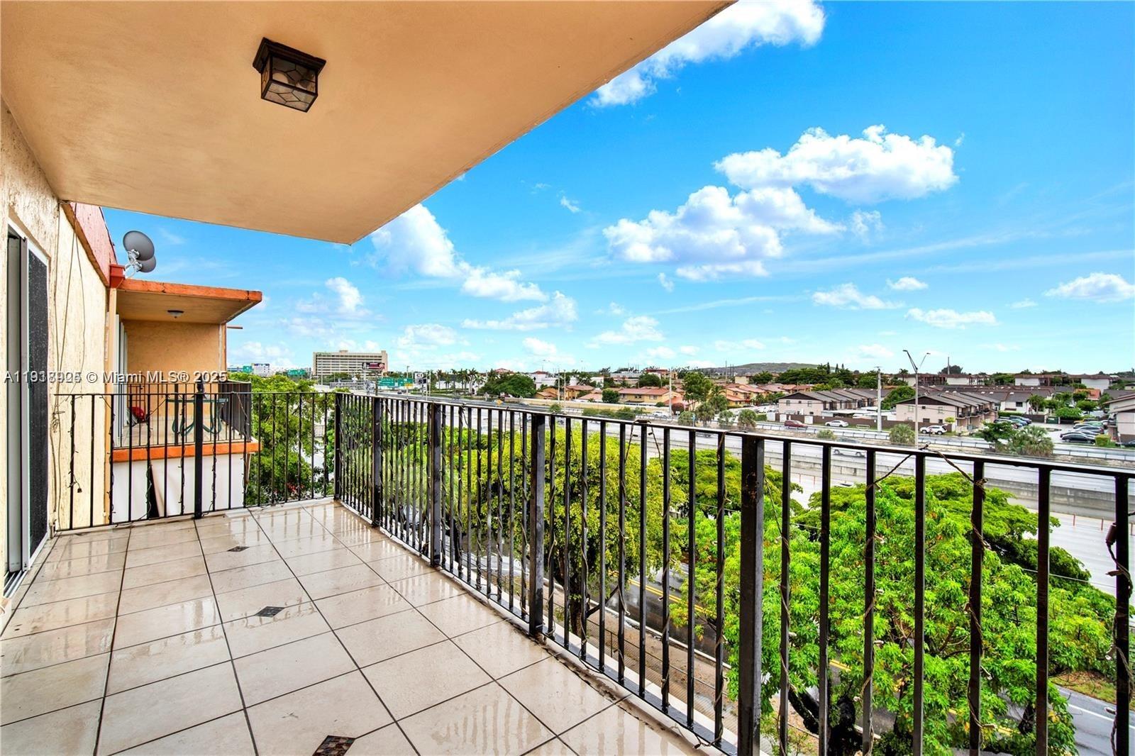 1990 West 56th Street, Unit 1407 Hialeah, FL 33012 - Photo 8 of 15 a view of a terrace with sky view
