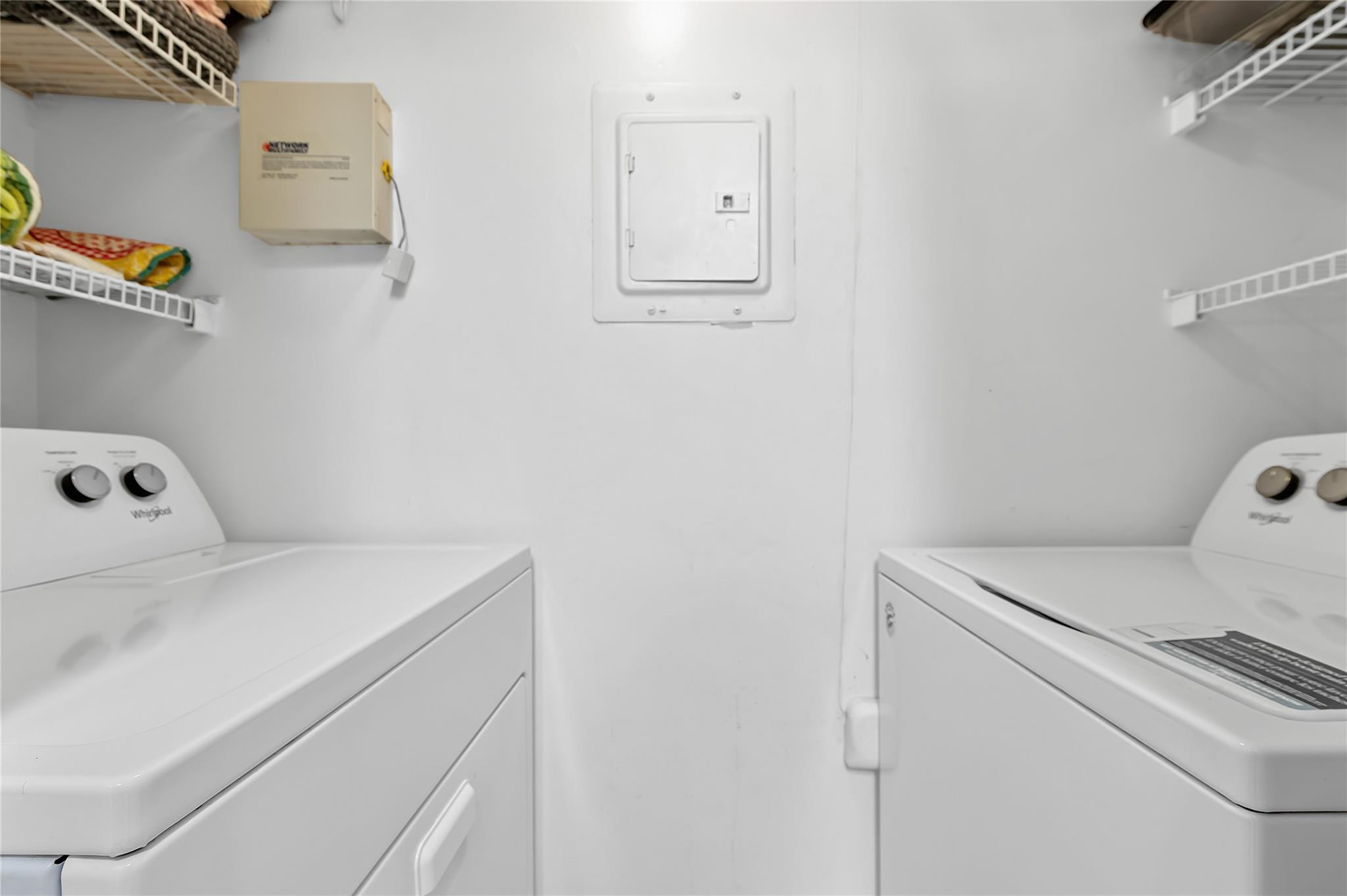 2133 Renaissance Boulevard, Unit 205 Miramar, FL 33025 - Photo 8 of 24 a utility room with dryer and washer