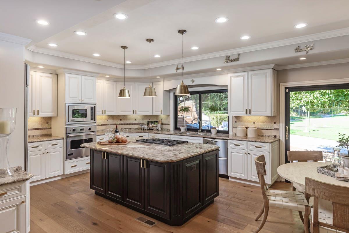 14945 Page Mill Road Los Altos Hills, CA 94022 - Photo 7 of 31 a kitchen with stainless steel appliances granite countertop a stove a sink dishwasher a oven and a refrigerator with wooden floor