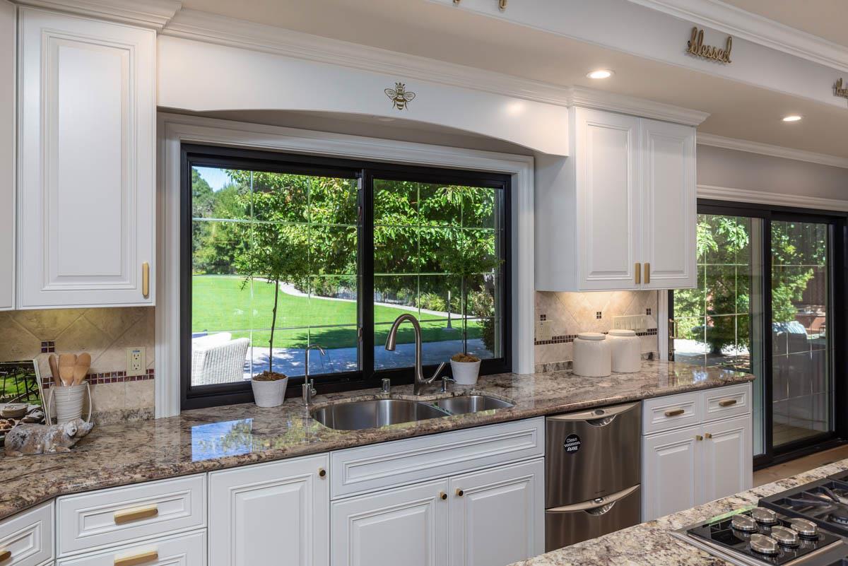 14945 Page Mill Road Los Altos Hills, CA 94022 - Photo 8 of 31 a kitchen with granite countertop a sink a counter top space and stainless steel appliances