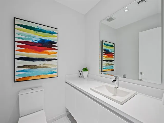 a bathroom with a sink and a large mirror