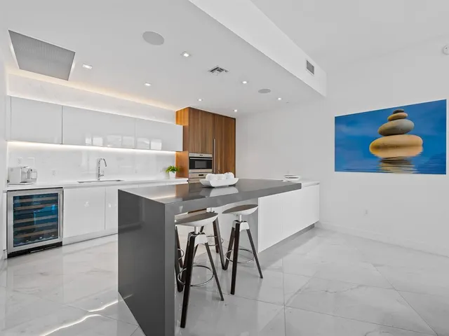 a kitchen with a sink cabinets and window