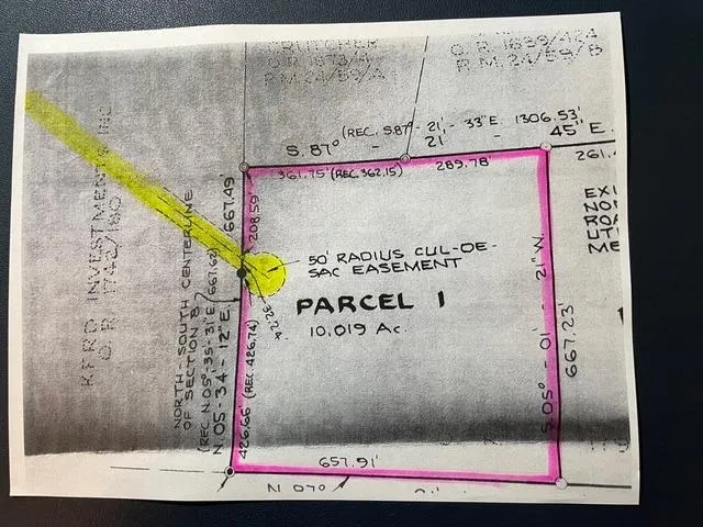 a view of a house with a yard and tree s