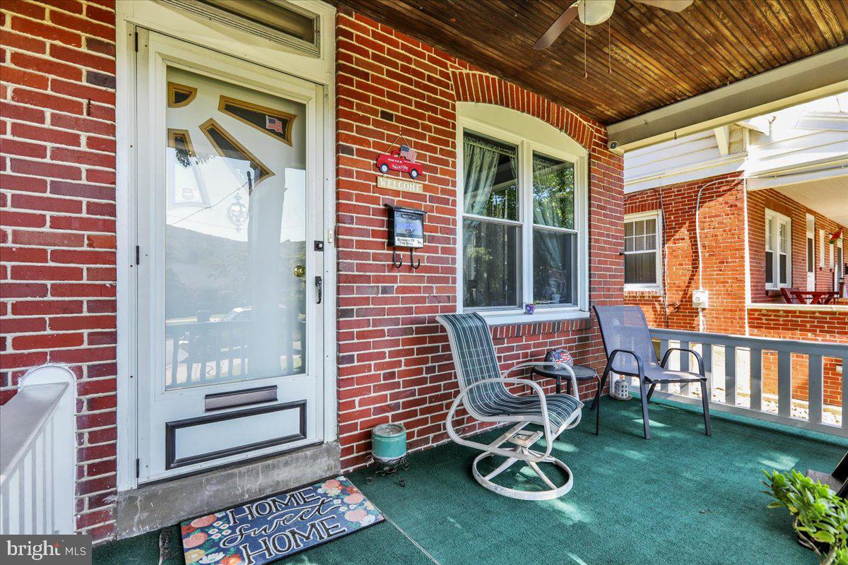 20 Myrtle Avenue Reading, PA 19606 - Photo 4 of 28 a table and chairs in front of a house