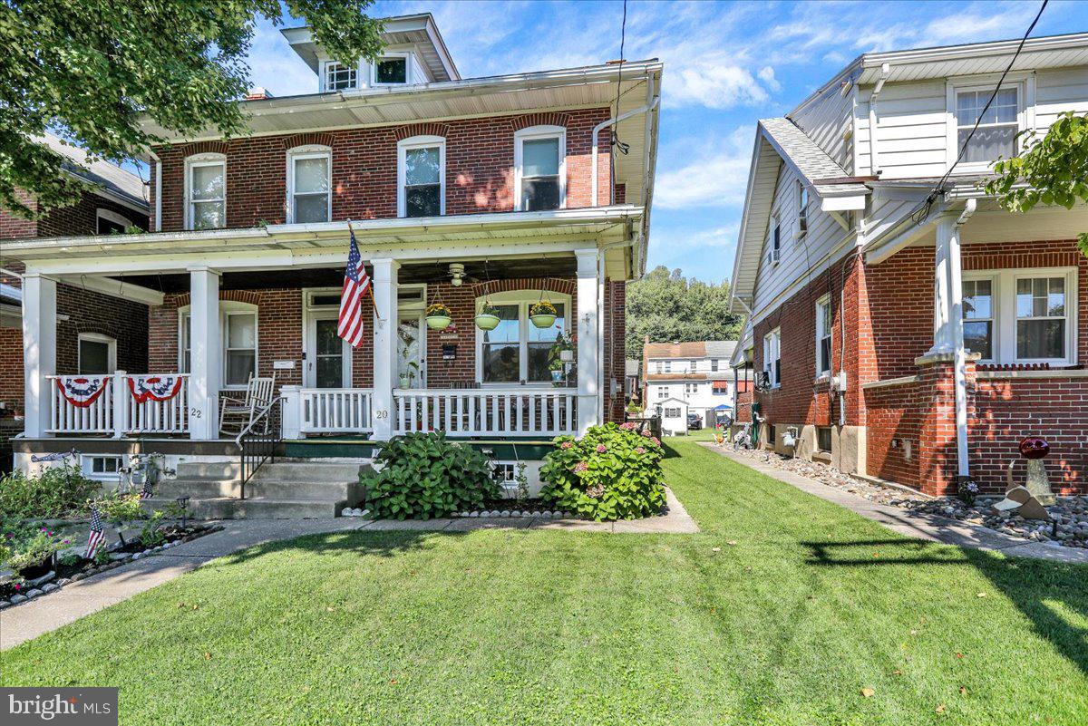 20 Myrtle Avenue Reading, PA 19606 - Photo 6 of 28 front view of a brick house with a yard