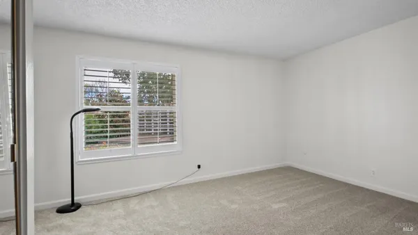 a view of a room that has a window in it
