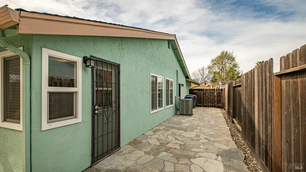 a view of a house with a backyard