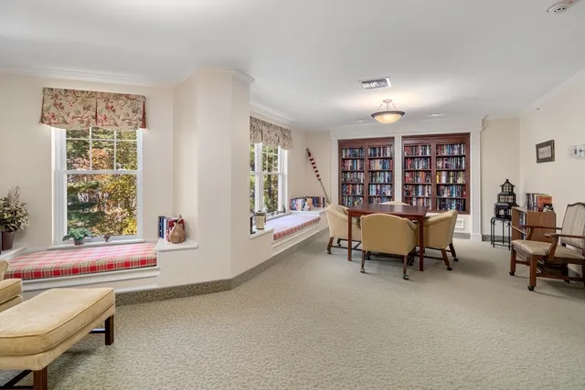 a room with furniture pool table and flat screen tv