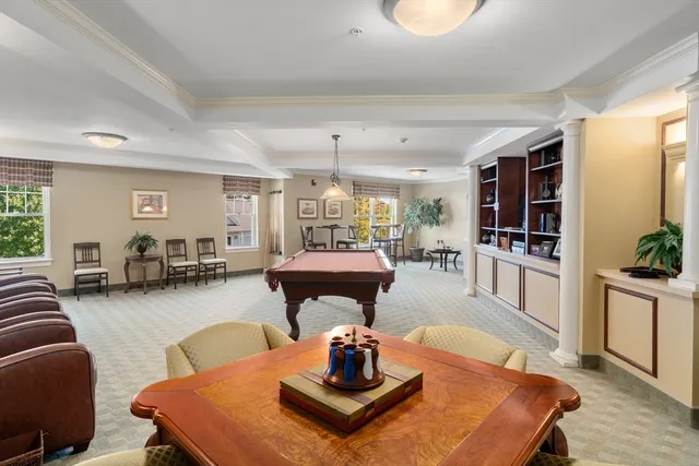 a view of a workspace with furniture and a living room