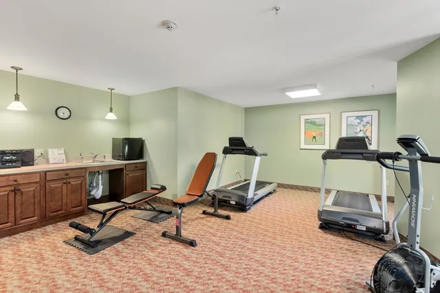 a kitchen with a stove a sink and a refrigerator
