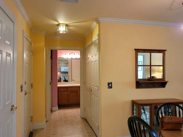 a balcony with chairs and a table