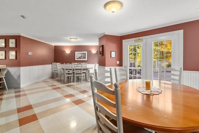 a view of a patio with a table and chairs
