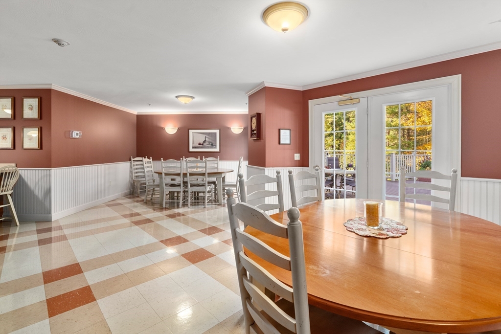 7 Crescent Way, Unit 105 Sturbridge, MA 01518 - Photo 9 of 35 a view of a dining room with furniture
