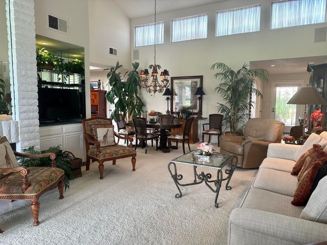 a living room with furniture and a book shelf
