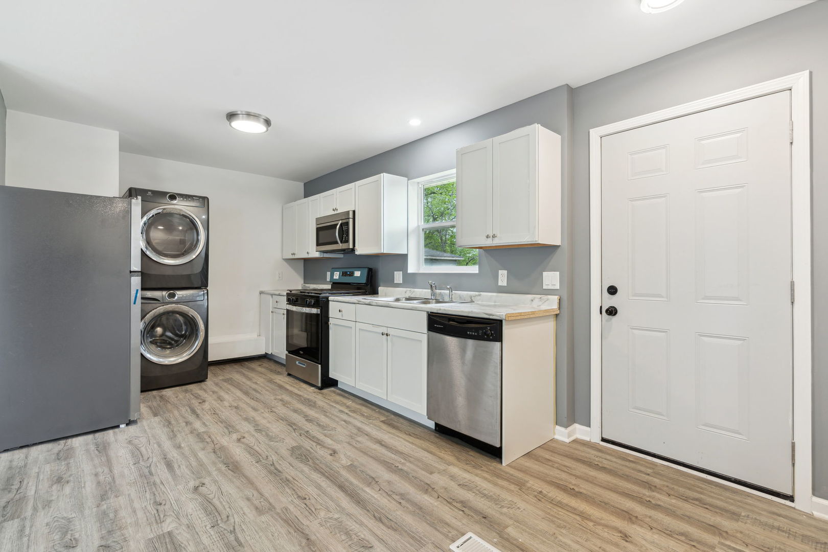 Undisclosed Address Chicago Heights, IL 60411 - Photo 12 of 20 a kitchen with a refrigerator and white cabinets