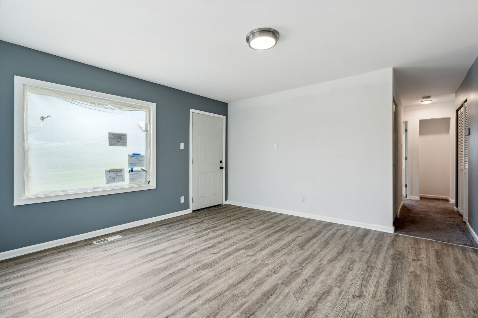 Undisclosed Address Chicago Heights, IL 60411 - Photo 15 of 20 a view of an empty room with wooden floor and a window