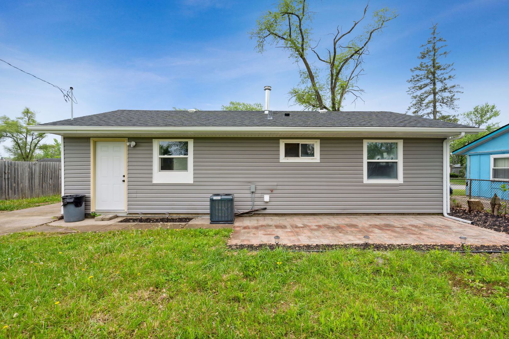 Undisclosed Address Chicago Heights, IL 60411 - Photo 17 of 20 a view of a house with a yard
