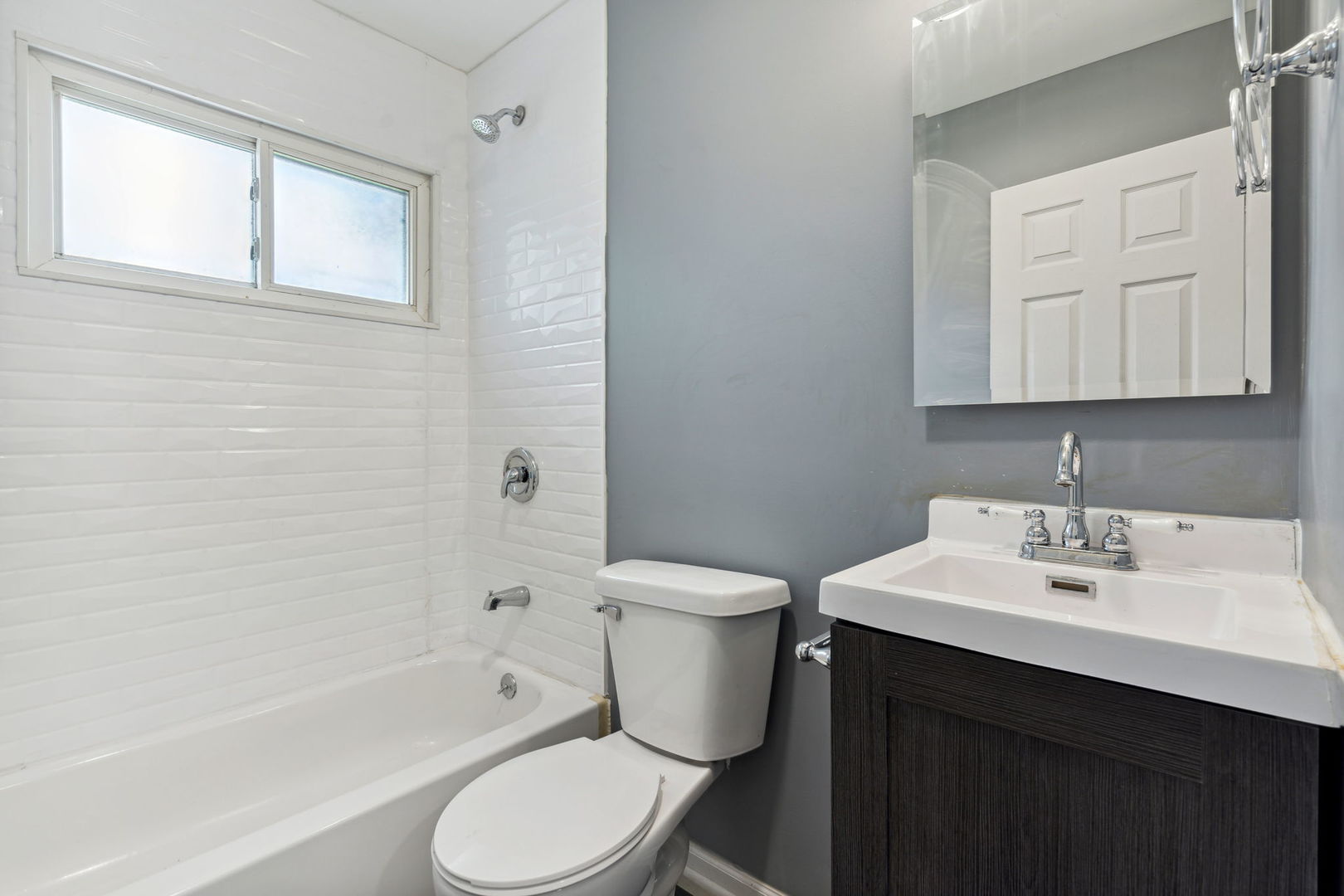 Undisclosed Address Chicago Heights, IL 60411 - Photo 8 of 20 a bathroom with a sink toilet and shower