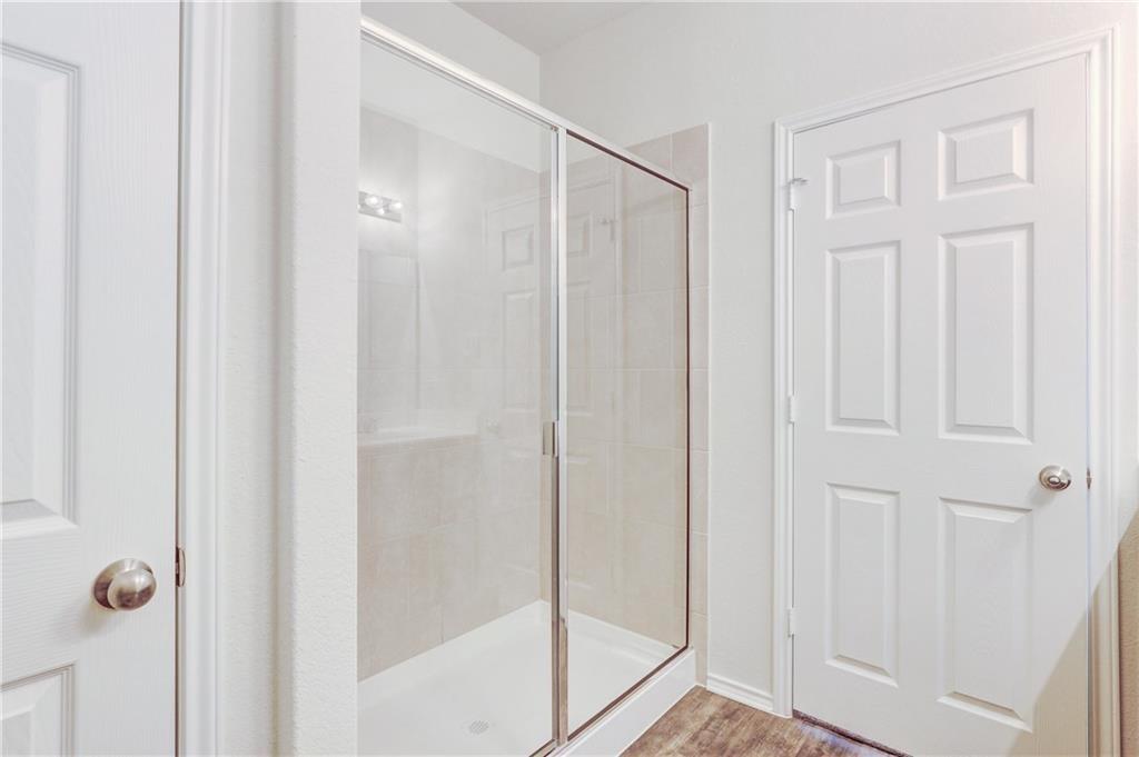 412 Ibis Falls Loop Jarrell, TX 76537 - Photo 16 of 29 Walk-in shower. Linen closet to the left of the shower.