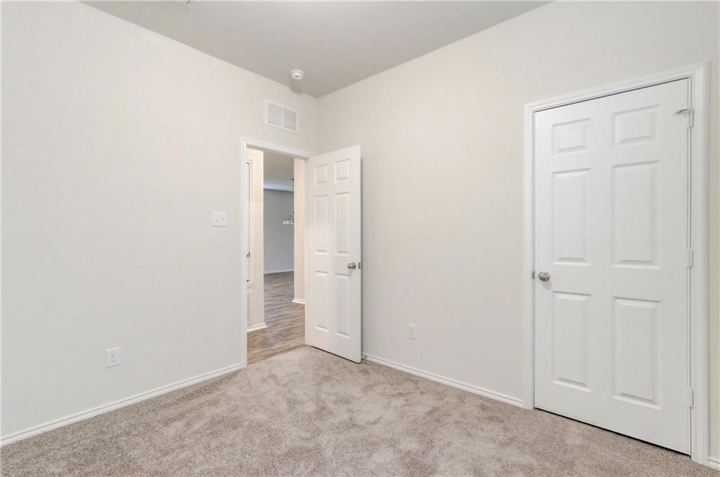 412 Ibis Falls Loop Jarrell, TX 76537 - Photo 18 of 28 an empty room with closet area