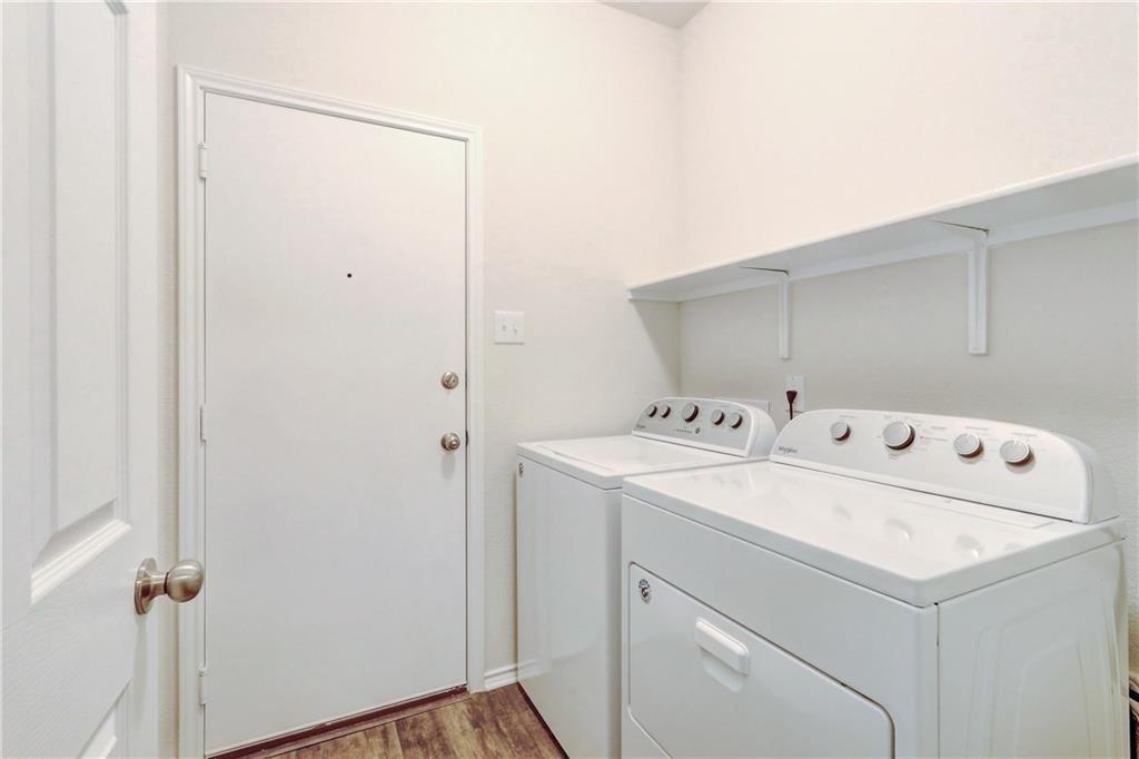 412 Ibis Falls Loop Jarrell, TX 76537 - Photo 20 of 28 a utility room with dryer and washer