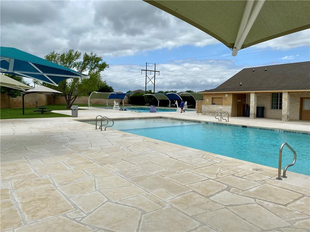 412 Ibis Falls Loop Jarrell, TX 76537 - Photo 23 of 28 a view of a house with a backyard