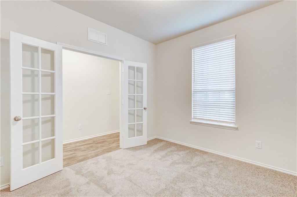 412 Ibis Falls Loop Jarrell, TX 76537 - Photo 5 of 28 a view of an empty room with a window