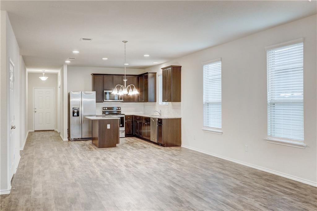 412 Ibis Falls Loop Jarrell, TX 76537 - Photo 9 of 29 large dining/family room open to kitchen