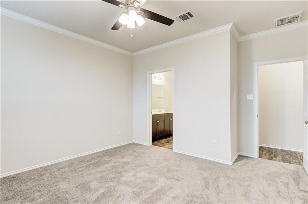 412 Ibis Falls Loop Jarrell, TX 76537 - Photo 10 of 28 a view of an empty room with a chandelier fan