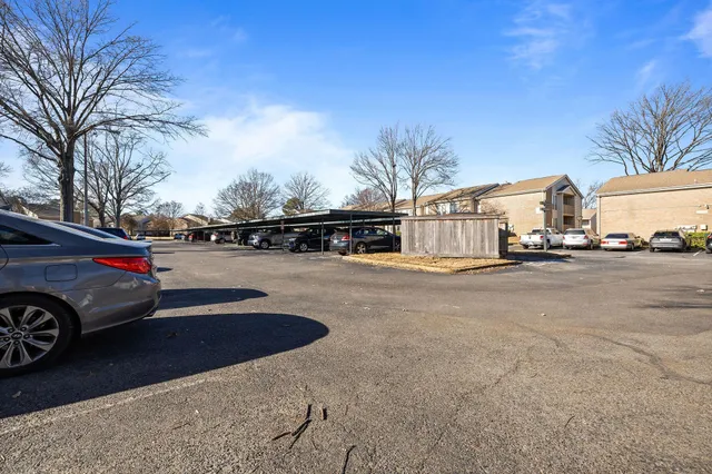 a view of street with parked cars