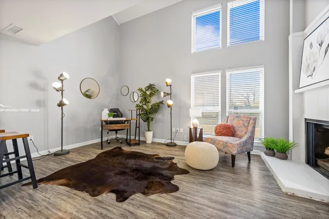 a living room with furniture window and wooden floor