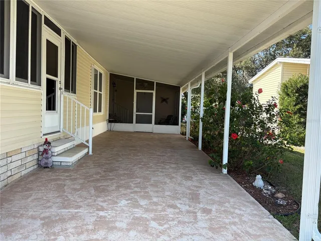 a bench sitting in front of a door