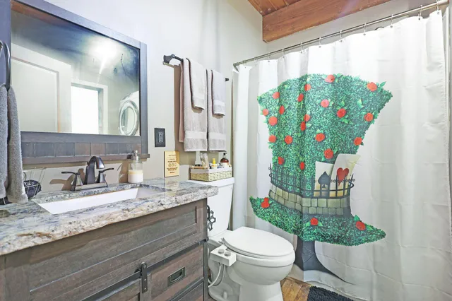 a bedroom with a bed and a fireplace