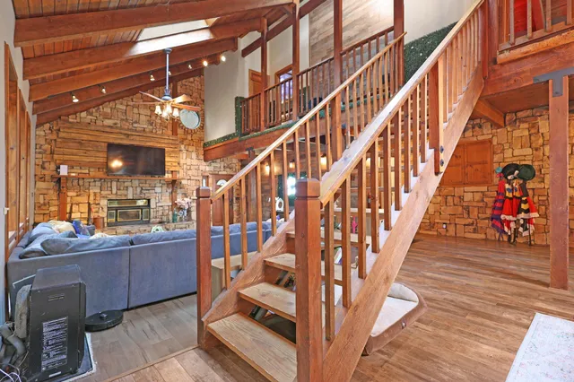 a bedroom with a bed and dresser with mirror