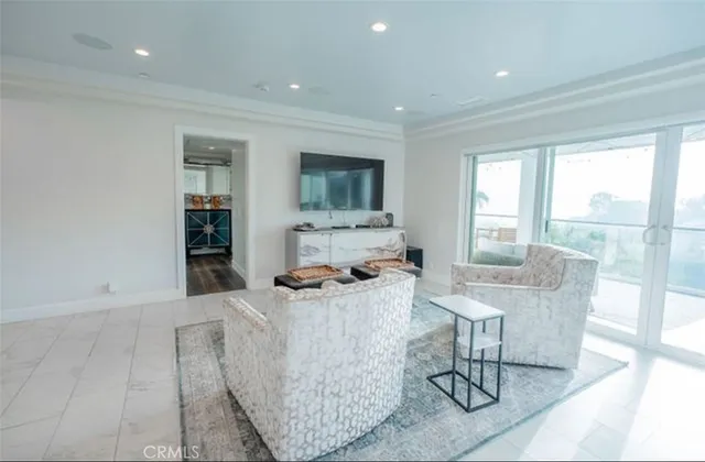 a front view of a house with a garden and plants