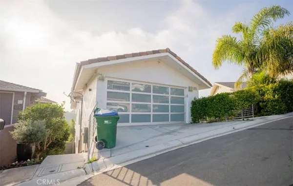 a bedroom with two beds and a night stand