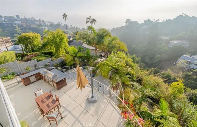 a bedroom with a bed and large window