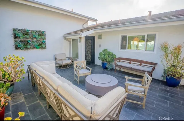 a large kitchen with stainless steel appliances granite countertop a refrigerator and a stove