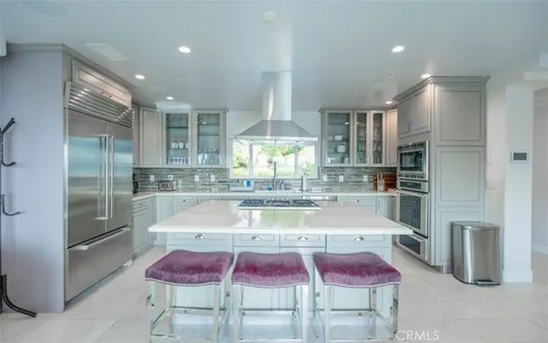 a table and chairs with the view of lake view