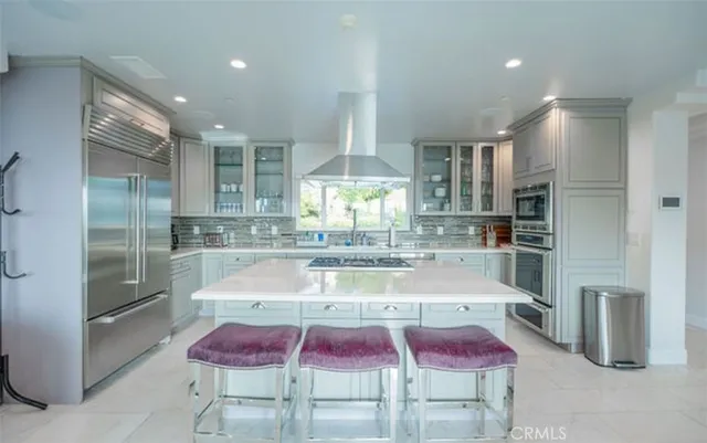 a table and chairs with the view of lake view