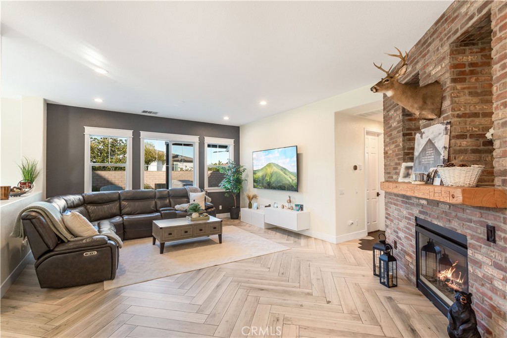 8824 Soothing Court Corona, CA 92883 - Photo 11 of 50 a living room with furniture and a fireplace