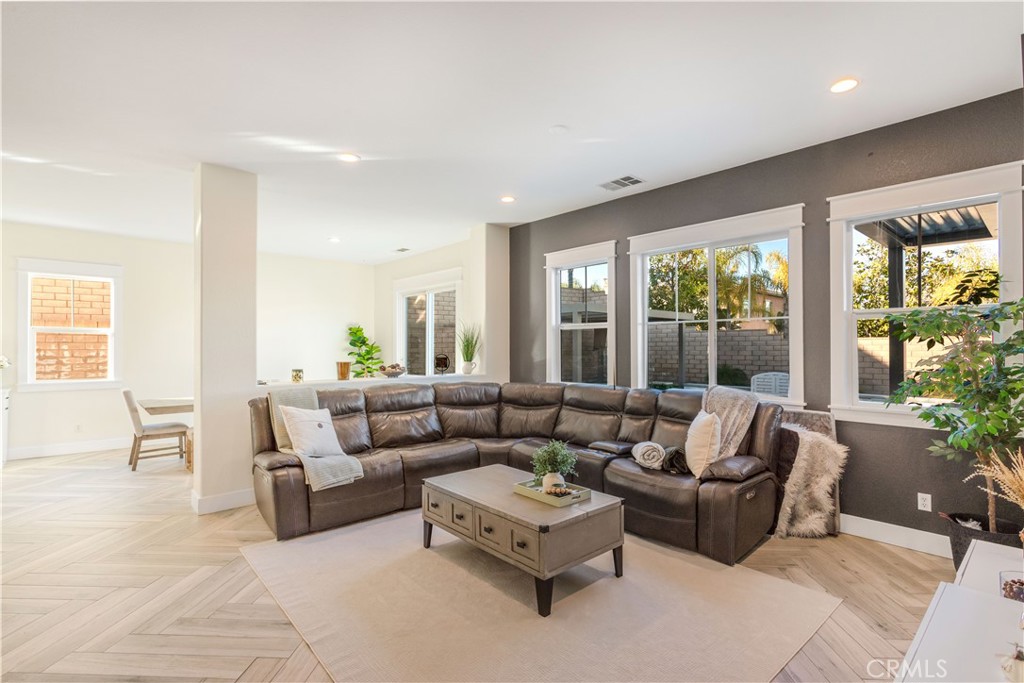 8824 Soothing Court Corona, CA 92883 - Photo 12 of 50 a living room with furniture and a large window