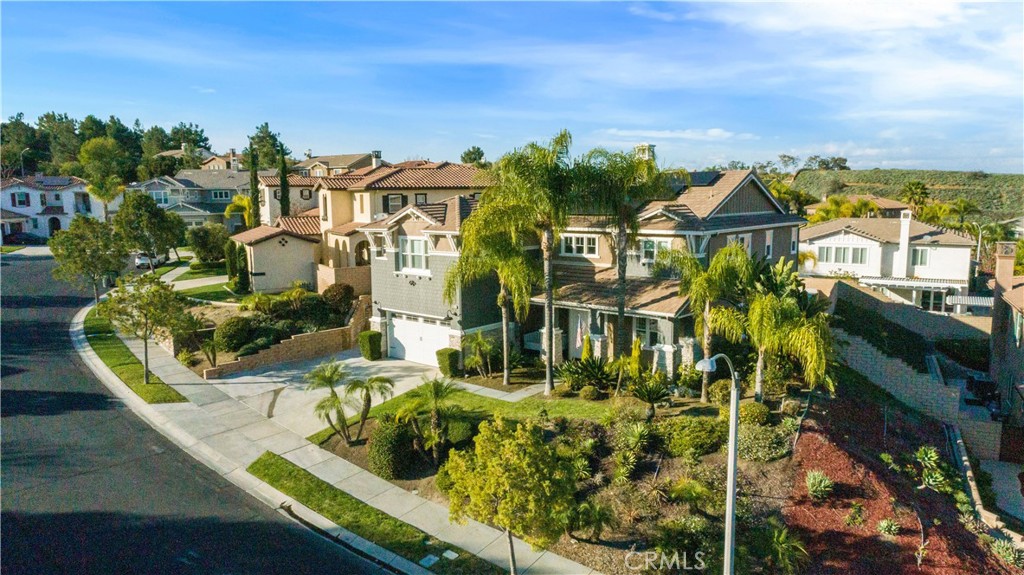 8824 Soothing Court Corona, CA 92883 - Photo 41 of 50 an aerial view of residential houses with outdoor space