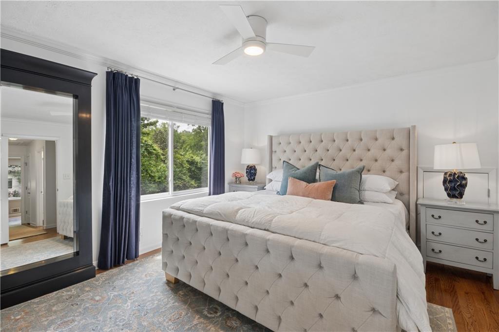 1493 Runnymeade Road Northeast Brookhaven, GA 30319 - Photo 20 of 40 a bedroom with a large bed and a window