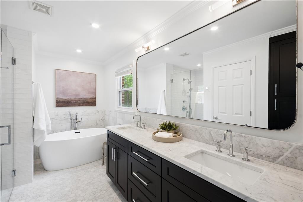 1493 Runnymeade Road Northeast Brookhaven, GA 30319 - Photo 21 of 40 a bathroom with a double vanity sink bathtub and double