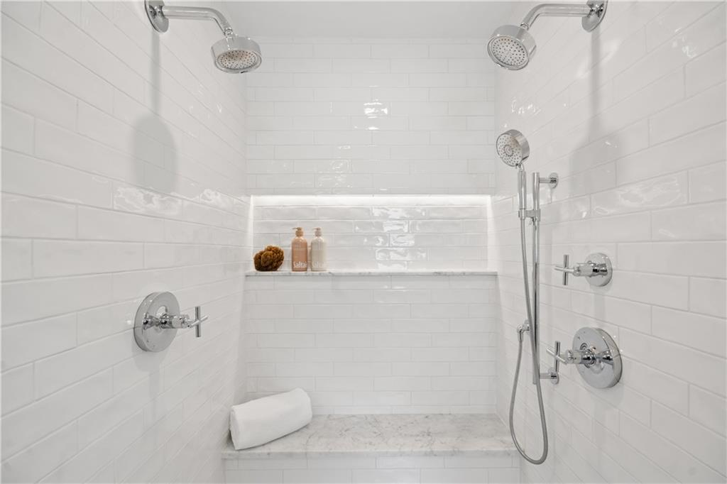 1493 Runnymeade Road Northeast Brookhaven, GA 30319 - Photo 22 of 40 a bathroom with a shower