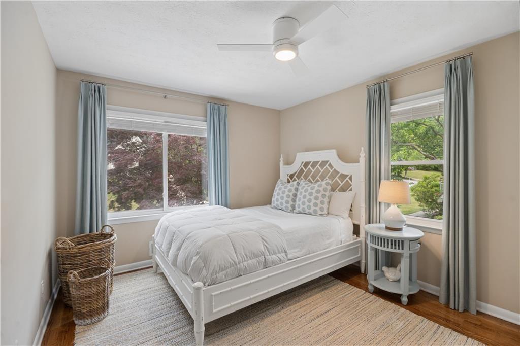 1493 Runnymeade Road Northeast Brookhaven, GA 30319 - Photo 29 of 40 a bedroom with a large bed and a large window