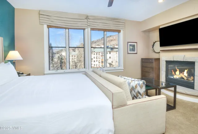 a living room with furniture and a walk in closet