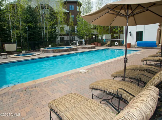 a view of a room with chairs and table